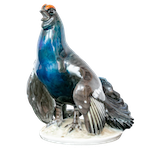 A red-crested Rosenthal blue bird ready to nest,